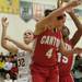 Dexter's Crystal Kedroske jumps as she to tires to make a rebound against Canton's Annie McDougall and Alanna Brown during the second half the regional semifinal game at Novi High School Tuesday, Mar. 5th.
Courtney Sacco I AnnArbor.com  
